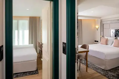 Un ou plusieurs lits dans un hébergement de l'établissement Hôtel des Champs-Elysées