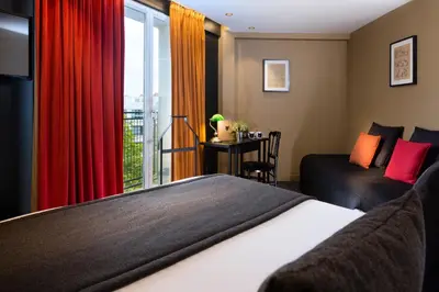 Un ou plusieurs lits dans un hébergement de l'établissement Hotel Le Chat Noir