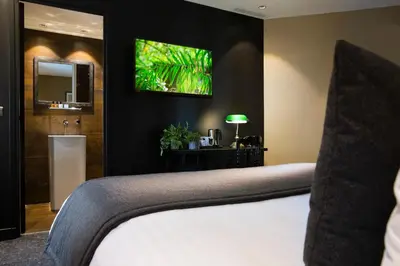 Un ou plusieurs lits dans un hébergement de l'établissement Hotel Le Chat Noir