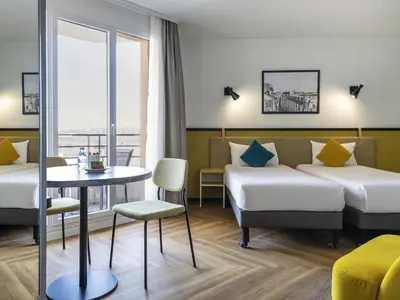 Un ou plusieurs lits dans un hébergement de l'établissement Aparthotel Adagio Paris Montrouge