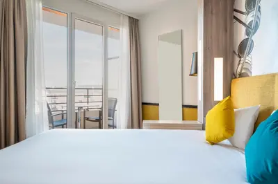 Un ou plusieurs lits dans un hébergement de l'établissement Aparthotel Adagio Paris Montrouge