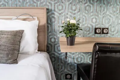 Un ou plusieurs lits dans un hébergement de l'établissement Hotel Chabrol Opera
