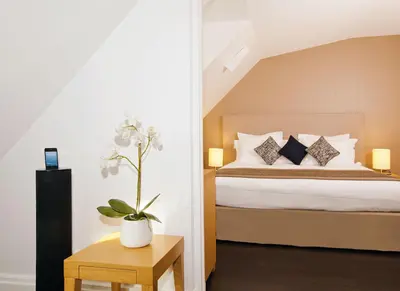 Un ou plusieurs lits dans un hébergement de l'établissement Residhome Paris Opéra