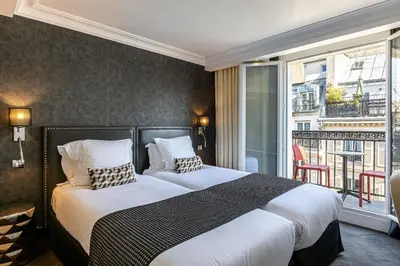 Un ou plusieurs lits dans un hébergement de l'établissement Hôtel Diva Opera