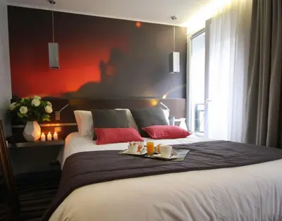 Un ou plusieurs lits dans un hébergement de l'établissement Hôtel Lumières Montmartre Paris