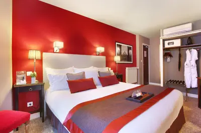 Un ou plusieurs lits dans un hébergement de l'établissement Hotel Trianon Rive Gauche