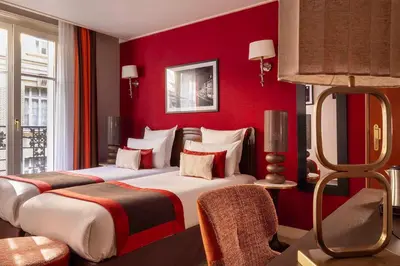 Un ou plusieurs lits dans un hébergement de l'établissement Hotel Trianon Rive Gauche