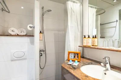 Salle de bains dans l'établissement Hotel Trianon Rive Gauche