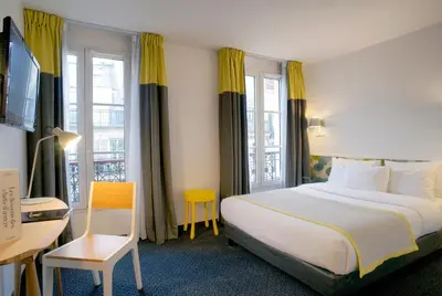 Un ou plusieurs lits dans un hébergement de l'établissement Hotel George - Astotel