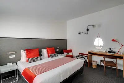 Un ou plusieurs lits dans un hébergement de l'établissement Hotel George - Astotel