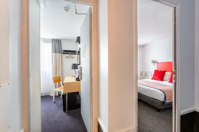Un ou plusieurs lits dans un hébergement de l'établissement Hotel George - Astotel