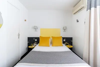 Un ou plusieurs lits dans un hébergement de l'établissement Hotel George - Astotel