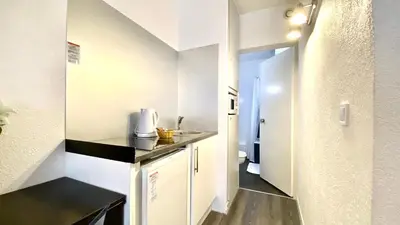 Cuisine ou kitchenette dans l'établissement Boulogne Résidence Hotel