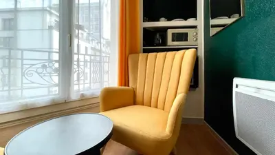Coin salon dans l'établissement Boulogne Résidence Hotel