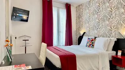 Un ou plusieurs lits dans un hébergement de l'établissement Boulogne Résidence Hotel
