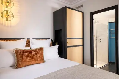 Un ou plusieurs lits dans un hébergement de l'établissement Grand Hôtel Chicago