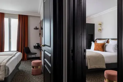 Un ou plusieurs lits dans un hébergement de l'établissement Grand Hôtel Chicago