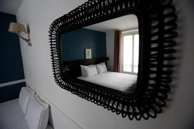 Un ou plusieurs lits dans un hébergement de l'établissement Hôtel Etoile Trocadéro