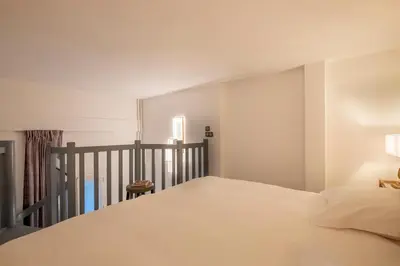 Un ou plusieurs lits dans un hébergement de l'établissement Hôtel Baudelaire Opéra