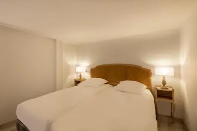 Un ou plusieurs lits dans un hébergement de l'établissement Hôtel Baudelaire Opéra