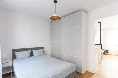 Un ou plusieurs lits dans un hébergement de l'établissement Eiffel Tower Royal Apartment