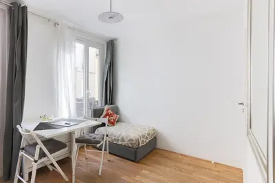 Un ou plusieurs lits dans un hébergement de l'établissement Eiffel Tower Royal Apartment