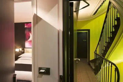 Un ou plusieurs lits dans un hébergement de l'établissement Hôtel Le Fabe
