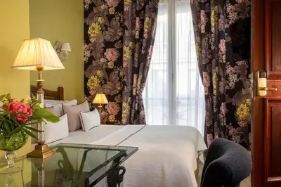 Un ou plusieurs lits dans un hébergement de l'établissement Hôtel Des Marronniers