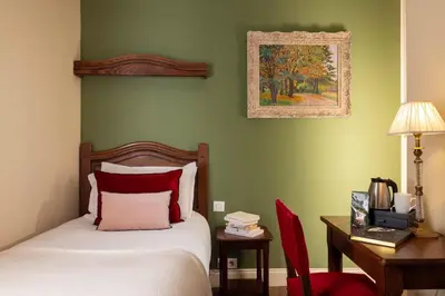 Un ou plusieurs lits dans un hébergement de l'établissement Hôtel Des Marronniers