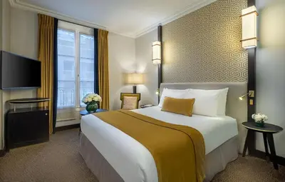 Un ou plusieurs lits dans un hébergement de l'établissement Hôtel Le Marquis by Inwood Hotels
