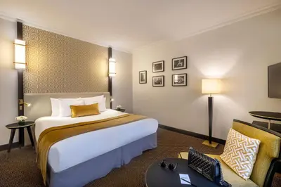 Un ou plusieurs lits dans un hébergement de l'établissement Hôtel Le Marquis by Inwood Hotels