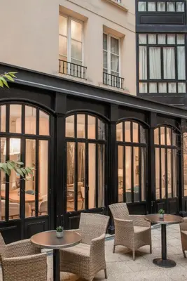 Coin salon dans l'établissement Hôtel Le Walt by Inwood Hotels