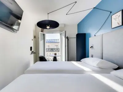 Un ou plusieurs lits dans un hébergement de l'établissement ibis Paris Père Lachaise