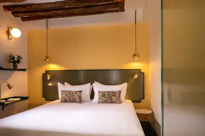 Un ou plusieurs lits dans un hébergement de l'établissement Hotel des Deux-Iles - Notre-Dame