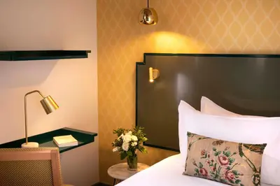 Un ou plusieurs lits dans un hébergement de l'établissement Hotel des Deux-Iles - Notre-Dame