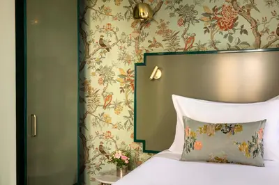 Un ou plusieurs lits dans un hébergement de l'établissement Hotel des Deux-Iles - Notre-Dame