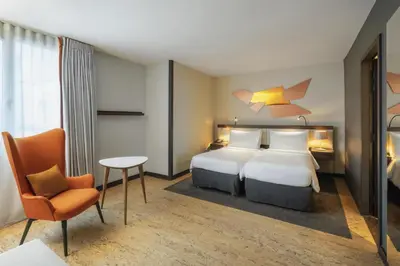 Un ou plusieurs lits dans un hébergement de l'établissement DoubleTree by Hilton Paris Boulogne