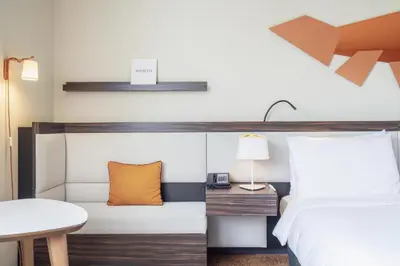 Un ou plusieurs lits dans un hébergement de l'établissement DoubleTree by Hilton Paris Boulogne