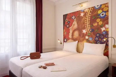 Un ou plusieurs lits dans un hébergement de l'établissement Timhotel Tour Montparnasse