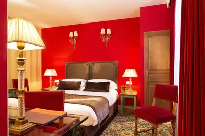 Un ou plusieurs lits dans un hébergement de l'établissement Hotel Des Deux Continents