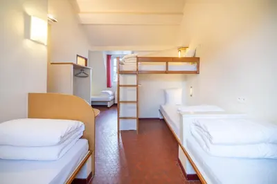 Un ou plusieurs lits dans un hébergement de l'établissement MIJE MARAIS Hostel