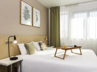 Un ou plusieurs lits dans un hébergement de l'établissement Aparthotel Adagio Access Paris Reuilly