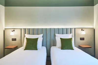Un ou plusieurs lits dans un hébergement de l'établissement Hotel 10 Opéra by HappyCulture