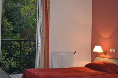 Un ou plusieurs lits dans un hébergement de l'établissement Hotel William's Opera