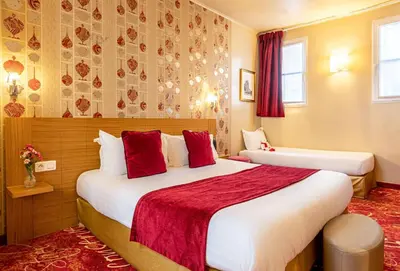Un ou plusieurs lits dans un hébergement de l'établissement Hotel Romance Malesherbes by Patrick Hayat
