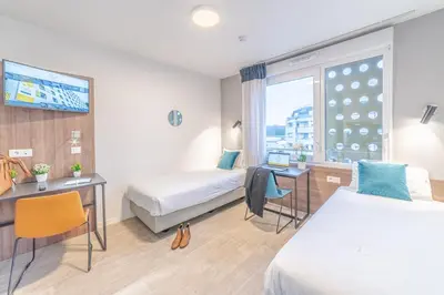 Un ou plusieurs lits dans un hébergement de l'établissement Break & Home Paris Italie Porte de Choisy Appart'Hôtel