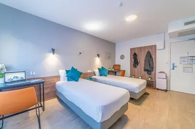 Un ou plusieurs lits dans un hébergement de l'établissement Break & Home Paris Italie Porte de Choisy Appart'Hôtel