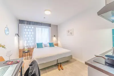Un ou plusieurs lits dans un hébergement de l'établissement Break & Home Paris Italie Porte de Choisy Appart'Hôtel
