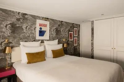 Un ou plusieurs lits dans un hébergement de l'établissement Hôtel Bourgogne & Montana