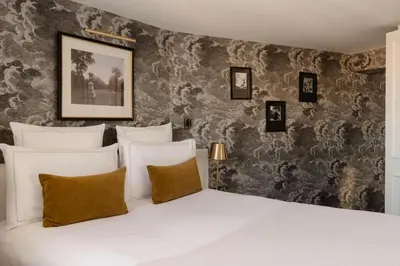 Un ou plusieurs lits dans un hébergement de l'établissement Hôtel Bourgogne & Montana